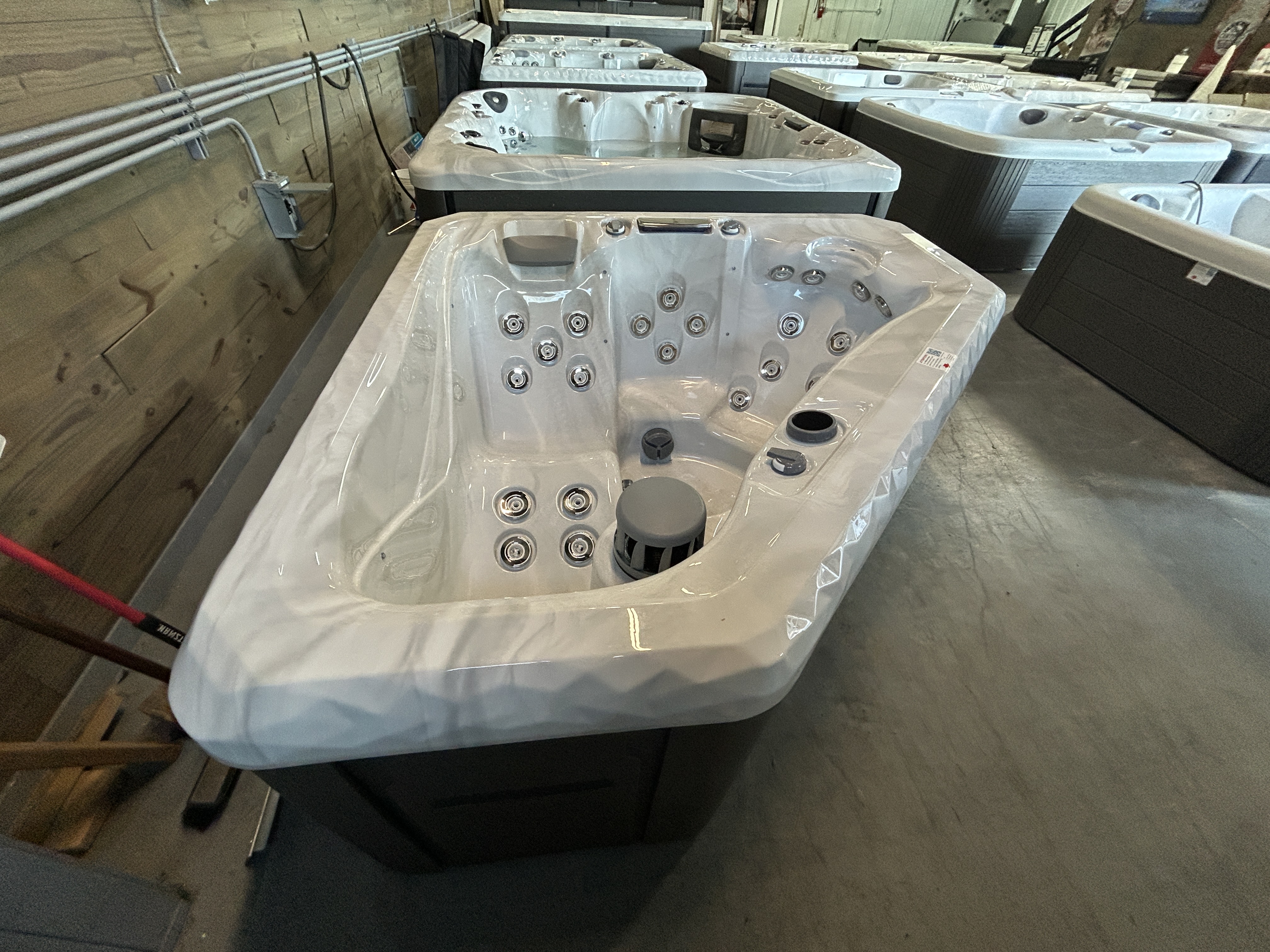 Master Spas TS 240X hot tub on a showroom floor at Healthy Living Spas in Mahomet, IL.