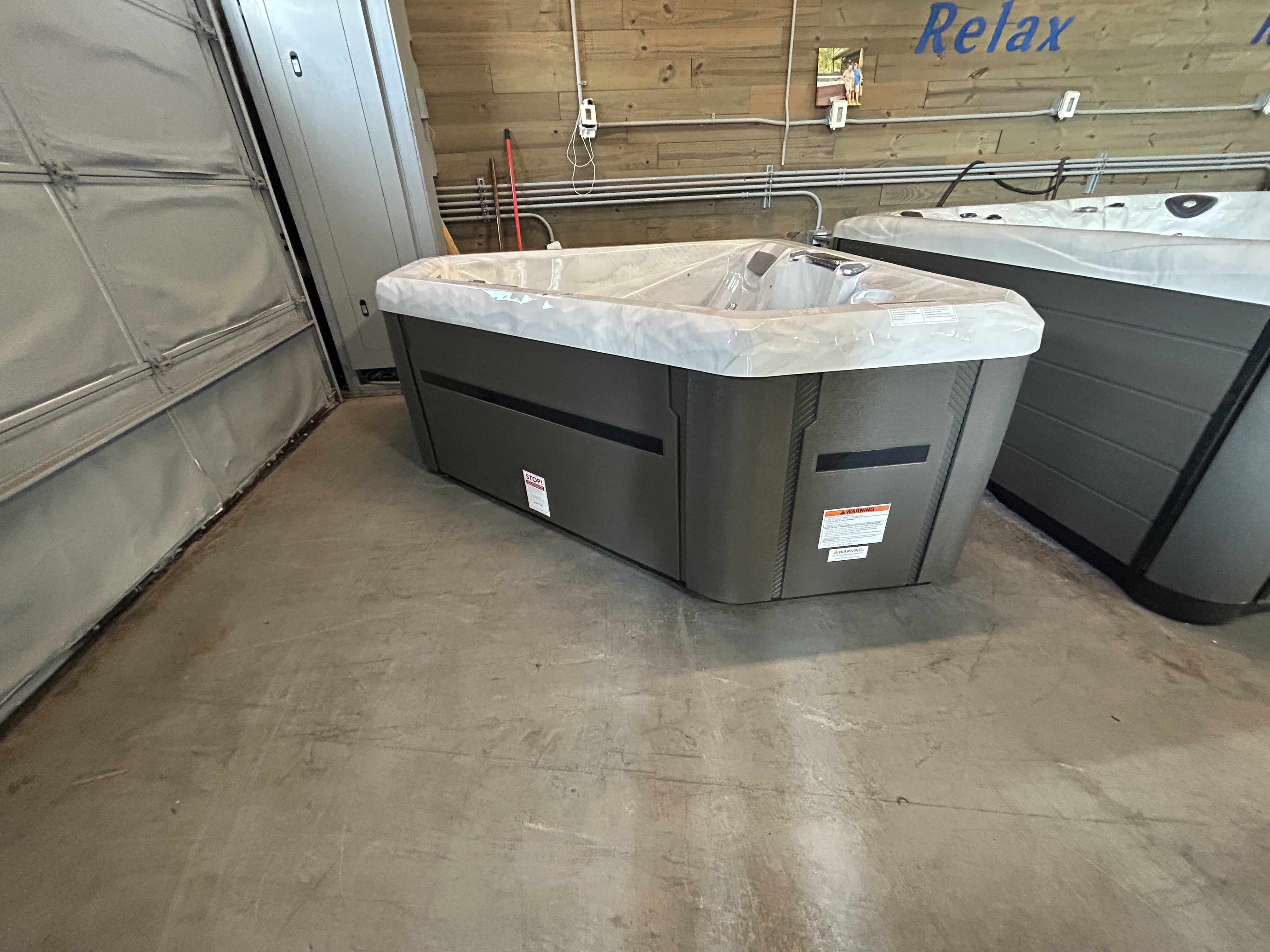 Master Spas TS 240X hot tub on a showroom floor at Healthy Living Spas in Mahomet, IL.