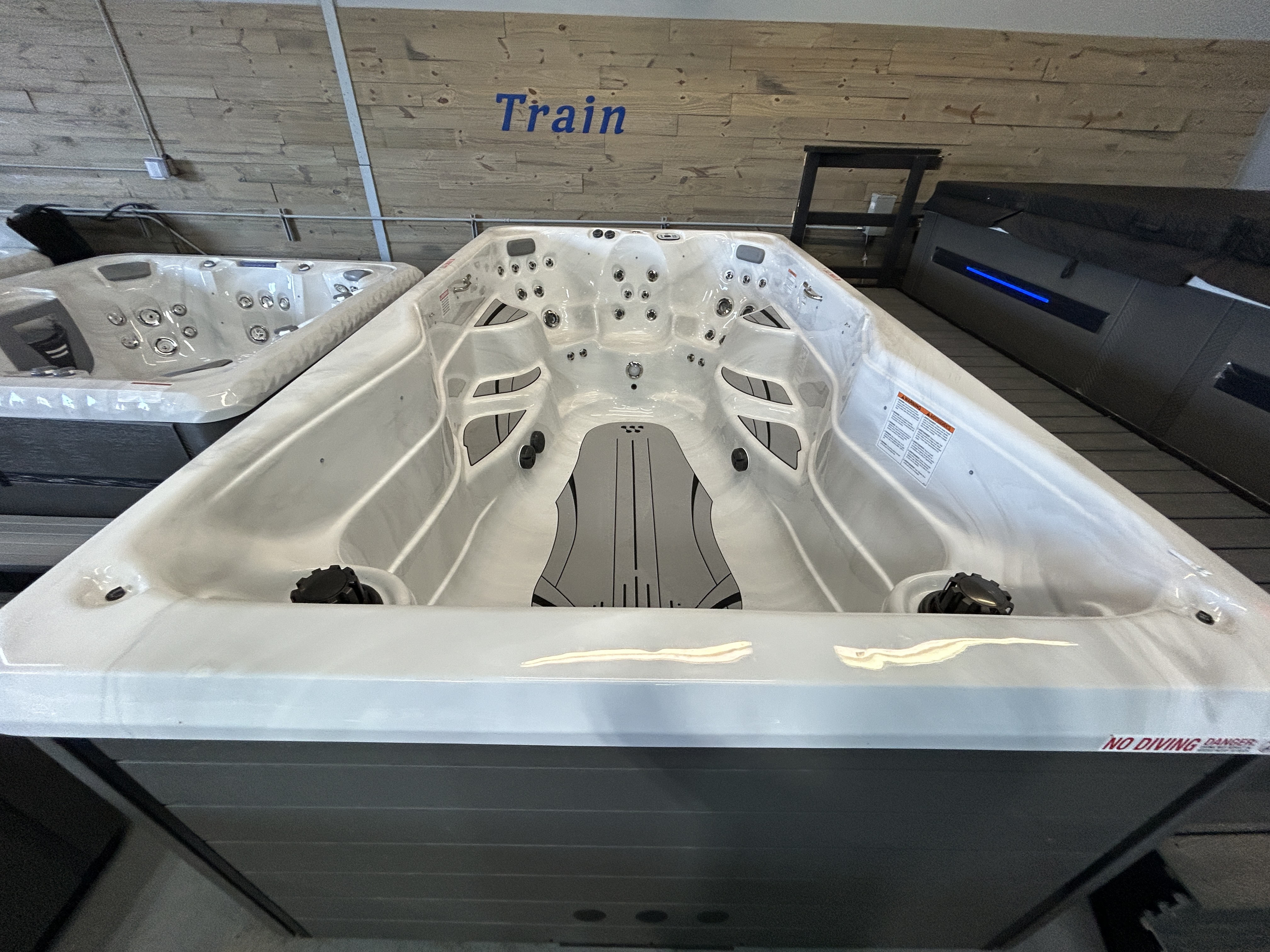 Master Spas Therapool 13 swim spa on display at a dealer showroom in Mahomet, IL.