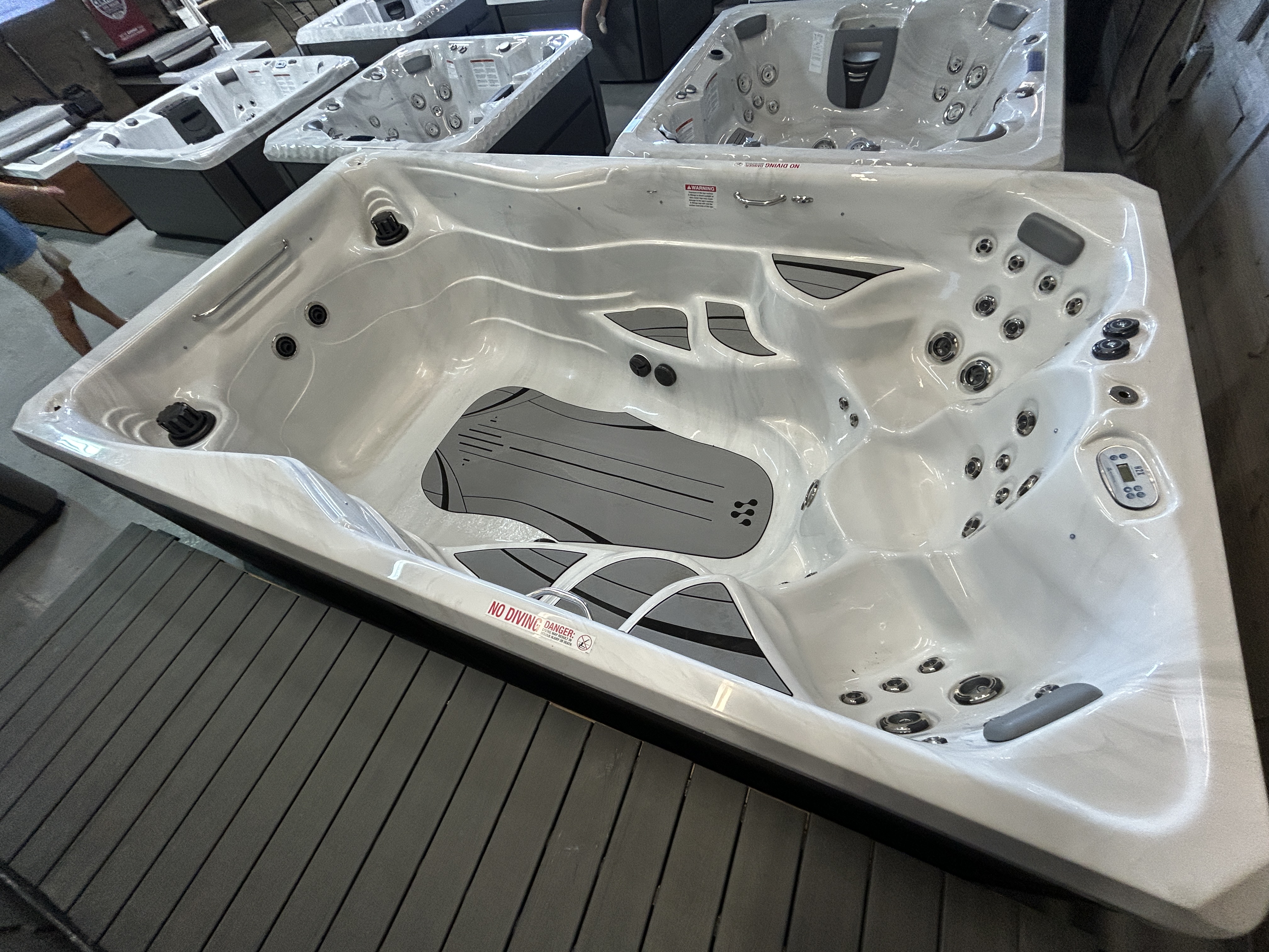 Master Spas Therapool 13 swim spa on a showroom floor in Mahomet, IL.
