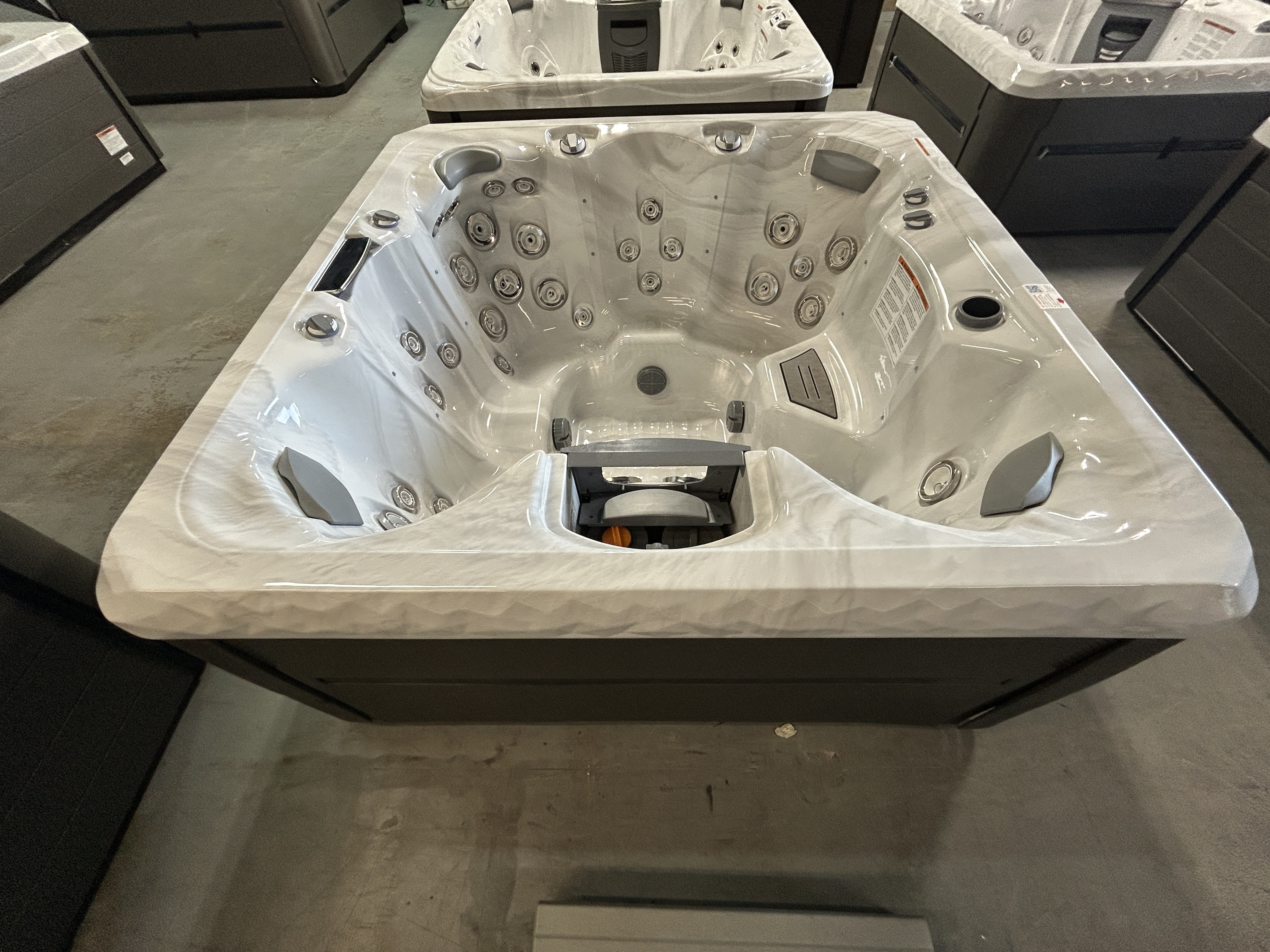 Master Spas TS 7.25 hot tub, sterling silver shell, in a dealer showroom in Mahomet, IL.